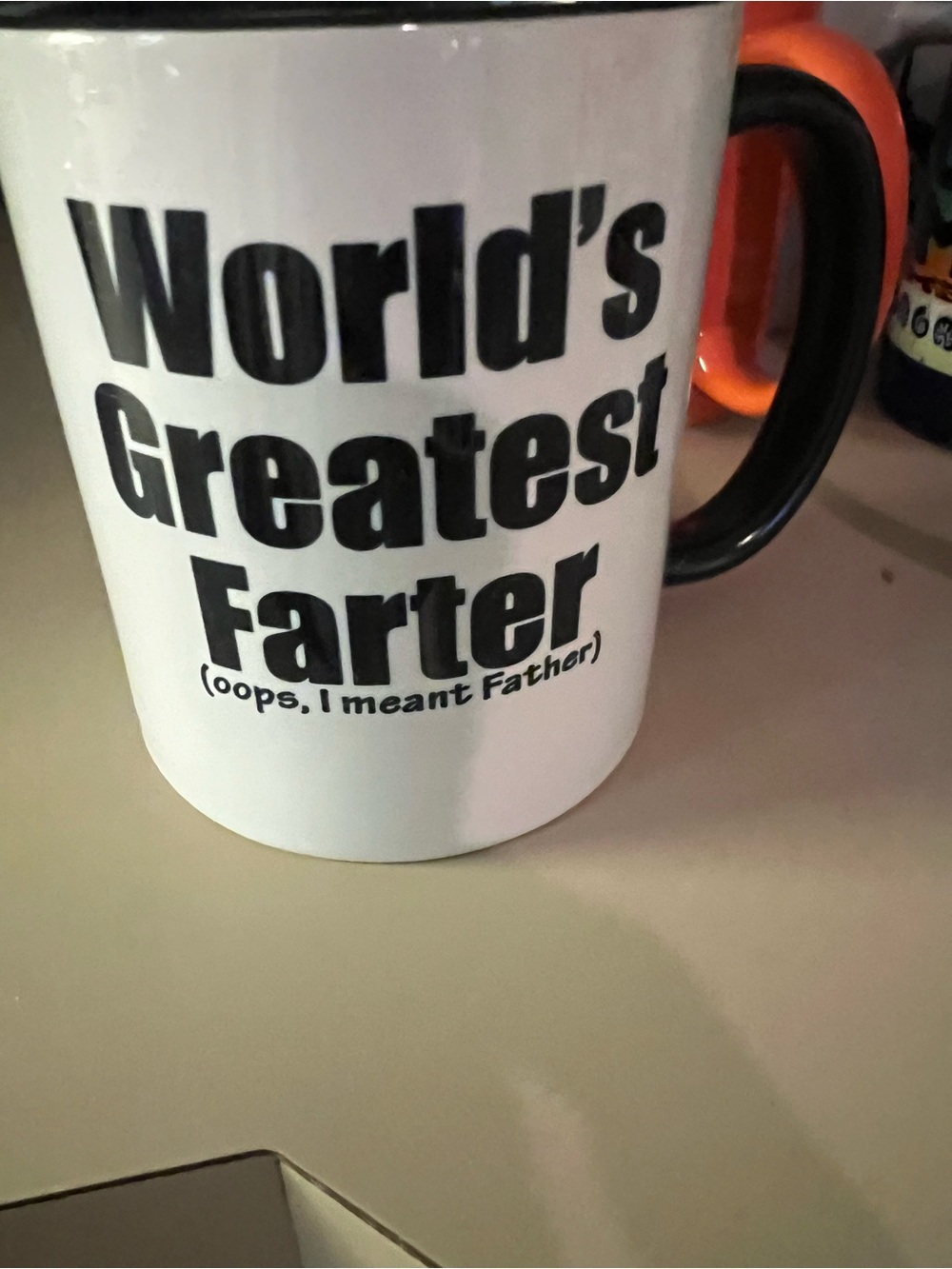White Ceramic Mug with Black Text "World's Greatest Farter"